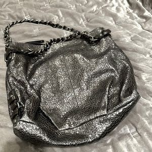 Shiny silver coach purse